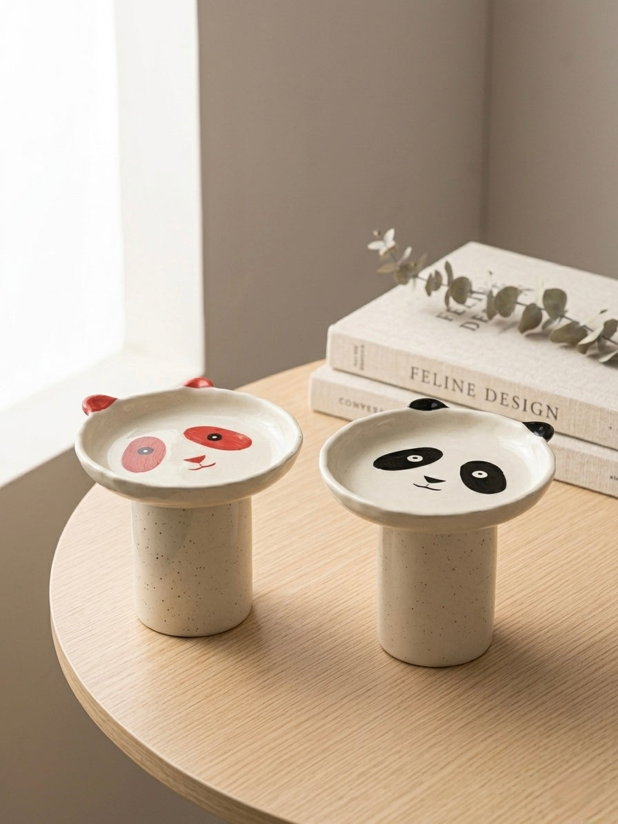 Boro Bowl in both colorways — terracotta and black panda — on a wooden table
