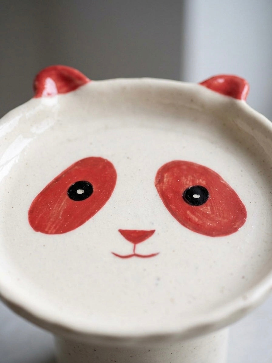 Close-up of the Boro Bowl's hand-painted terracotta panda face